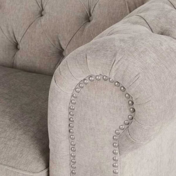 Sofá Chesterfield de terciopelo beige rosado